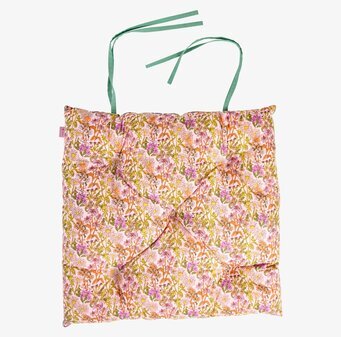 Foto av färgglad stolsdyna med blommigt mönster