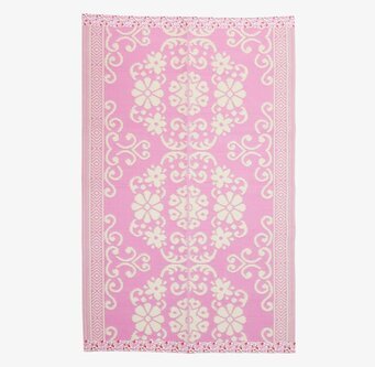 Bild av plastmatta med rosa och vita blommönster