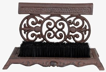 Foto av robust skoskrapa med borste och dekorativ design