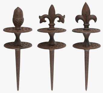 Bild av dekorativa gjutjärnsslangguider för trädgård