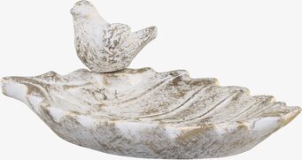 Foto av dekorativt fågelbad med guldmönster