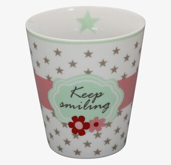 Foto av mugg med stjärnor och blommor i pastellfärger