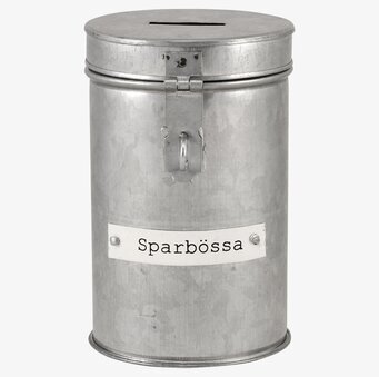 Foto av cylindrisk sparbössa i rustik, industriell stil