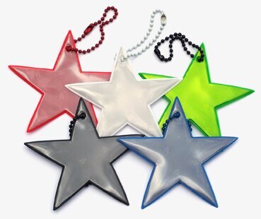 Bild av färgglada reflexstjärnor för säkerhet i mörker