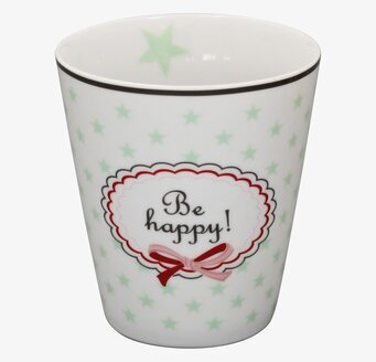 Bild av mugg med stjärnor och texten Be happy