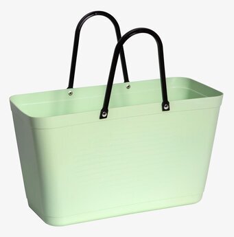 Bild av ljusgrön väska med svart handtag och nitar