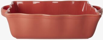 Bild av en stilren och funktionell ugnsform i korall