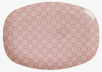 Foto av tallrik med rosa blommönster och oval form