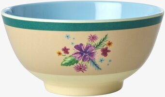 Bild av färgglad skål med blommigt tryck och blå insida