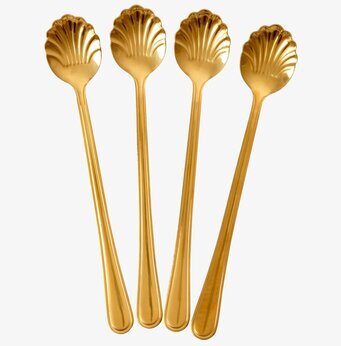 Bild av eleganta gyllene skedar med snäckskalstema