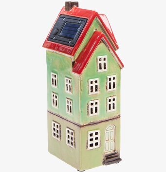 Foto av dekorativt solcellshus i ljusgrön keramik
