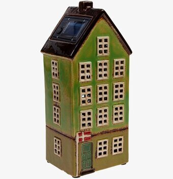 Bild av solcellsbelysning i form av ett charmigt hus