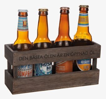 Bild av stilren trälåda med fyra färgglada ölflaskor