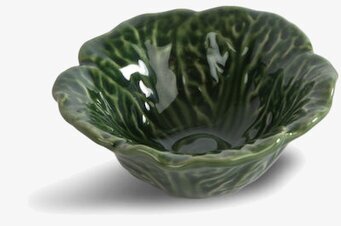 Foto av grön keramisk skål med bladliknande design
