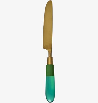 Foto av en unik kniv med mässing och gröna detaljer