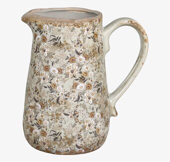 Bild av kanna med tidlöst blommönster och glasyr