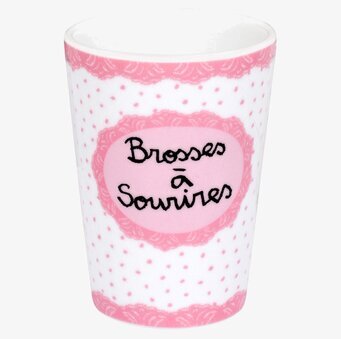 Bild av ljusrosa tandborstmugg med spetsdesign