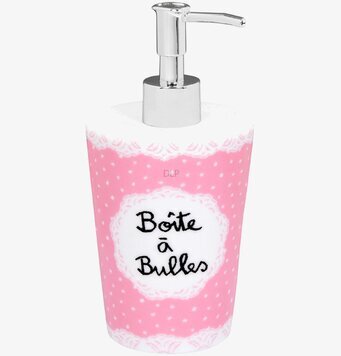 Bild av rosa tvålpump med prickar och elegant design