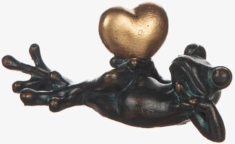 Bild av groda med gyllene hjärta i avslappnad pose