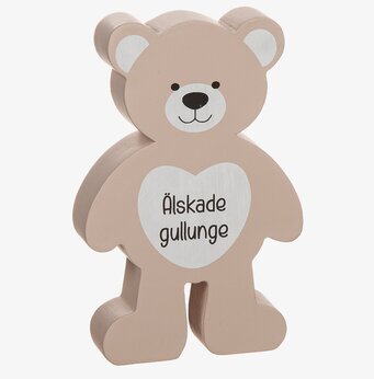Bild av en dekorativ nallebjörn med hjärta och text
