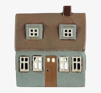 Foto av en unik ljuslykta i husform för hemtrevnad