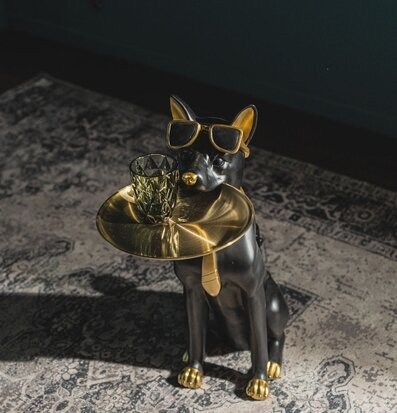 Foto av lekfullt sidobord med hunddesign i svart/guld