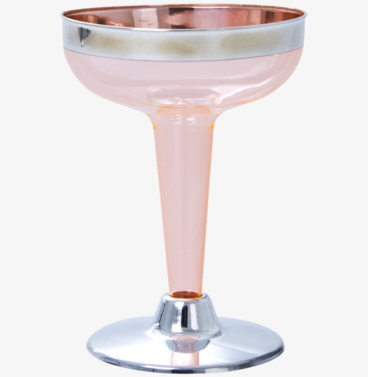 Bild av korallfärgat champagneglas med silverdetaljer