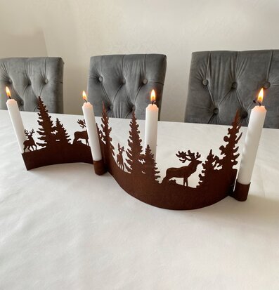 Foto av elegant ljusstake med naturinspirerat motiv