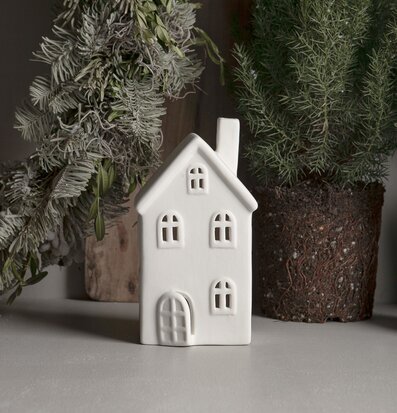 Foto av en minimalistisk keramisk ljusstake