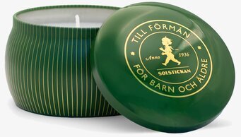 Bild av elegant designat doftljus i djupgrön burk