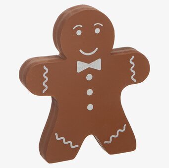 Bild av dekorativ pepparkaksfigur med vita detaljer