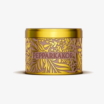 Bild av dekorativ burk med pepparkakor i guldtoner