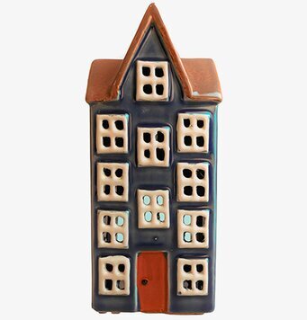 Bild av dekorativ ljuslykta i husform och blå toner