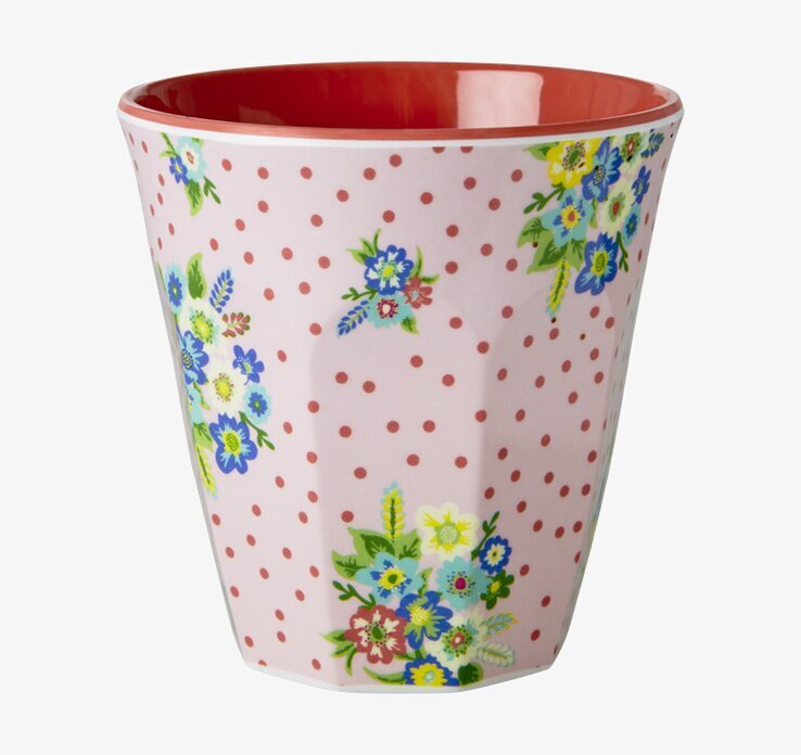 Bild av stilren mugg med retro blommönster i livliga färger