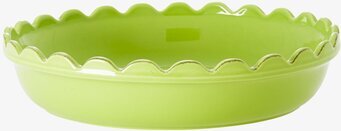 Foto av grön pajform med vågig kant och glansig yta