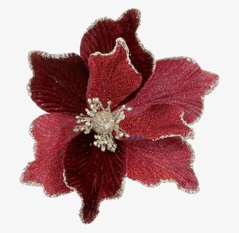 Bild av konstgjord julblomma med glittrande detaljer