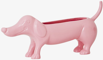 Foto av vårpigmenterad blomkruka formad som en tax