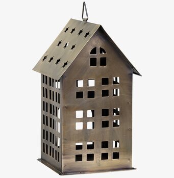 Foto av en dekorativ ljuslykta i antik mässing