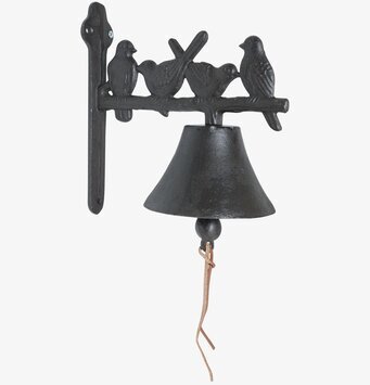 Foto av dekorativ gjutjärnsklocka med fågelmotiv