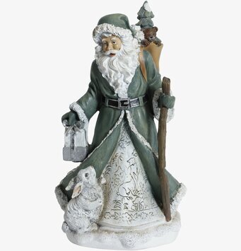 Bild av en detaljrik tomtefigur i vinterlandskap