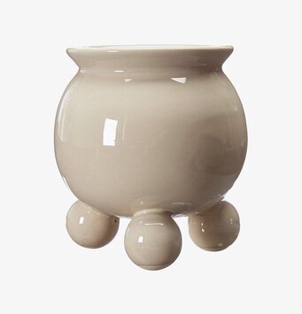 Bild av stilren kruka med unik design och beige ton