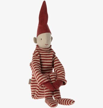 Bild av charmig och uttrycksfull figur i randig dräkt