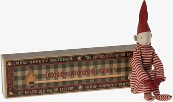 Bild av charmig textilfigur med långbenta detaljer