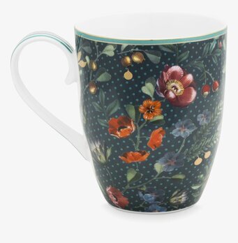 Bild av elegant mugg med blommigt mönster