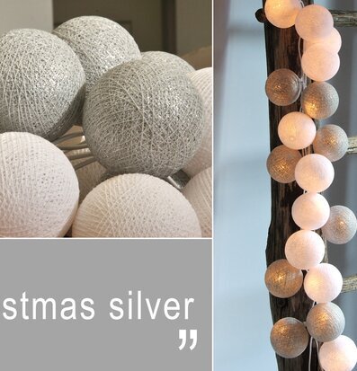 Bild av dekorativ ljusslinga i silver och vitt