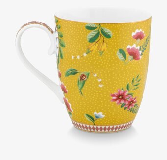 Bild av en färgglad och elegant mugg med blommotiv
