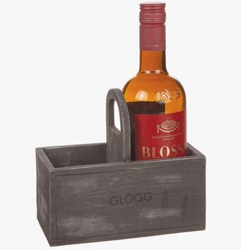 Bild av rustik trälåda med glöggflaska och handtag