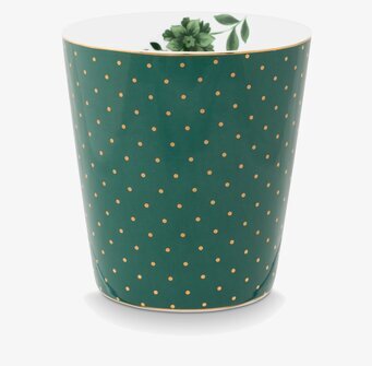 Bild av grön mugg med gyllene prickar och blommotiv