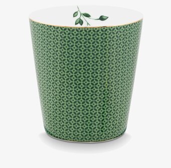 Foto av grön mugg med detaljerat mönster och guldkant