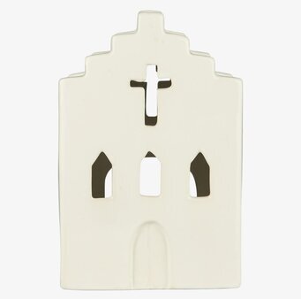 Foto av krämfärgad ljuslykta formad som en kyrka